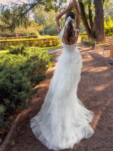 Shimmering ball gown with textured skirt and high slit
