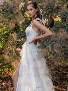 Shimmering ball gown with textured skirt and high slit