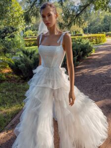Shimmering ball gown with textured skirt and high slit