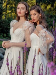Long-sleeve sheath wedding dress with extended shoulders and Tulle A-line wedding dress with floral sleeves
