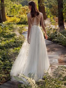 Shimmering lace A-line wedding dress with beaded shoulders