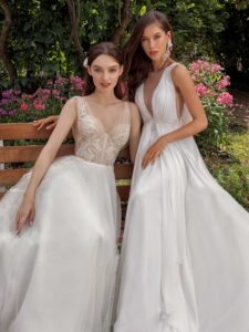 A-line wedding dress with bustier style corset, floral decor and pockets and Plunging neckline chiffon wedding dress with detachable cape sleeves and open back