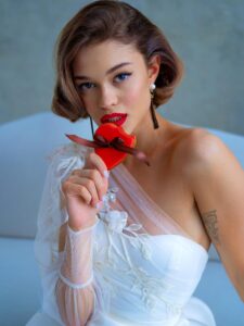 One-sleeve ball gown wedding dress with high slit and pockets