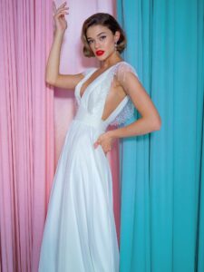 Chiffon sheath wedding gown with embroidered plunging V-neckline and open back