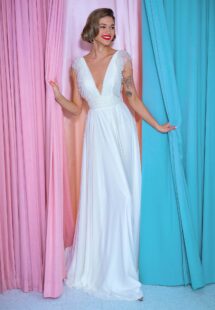 Style #2212L, chiffon sheath wedding gown with embroidered plunging V-neckline and open back, available in ivory