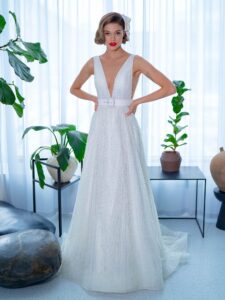 Sequinned lace A-line wedding dress with plunging V-neckline and belt
