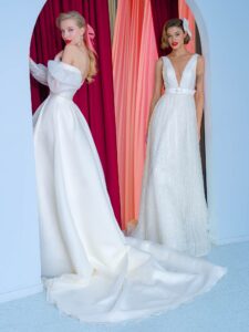 Style #2216L Long-sleeve A-line wedding dress with bishop style sleeves and high slit skirt | Style #2205L Sequinned lace A-line wedding dress with plunging V-neckline and belt