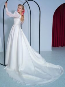 Long-sleeve A-line wedding dress with bishop style sleeves and high slit skirt
