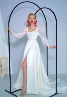 Style #2216L, long-sleeve A-line wedding dress with bishop style sleeves and high slit skirt, available in ivory