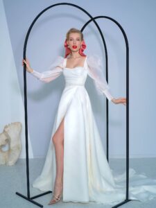 Long-sleeve A-line wedding dress with bishop style sleeves and high slit skirt