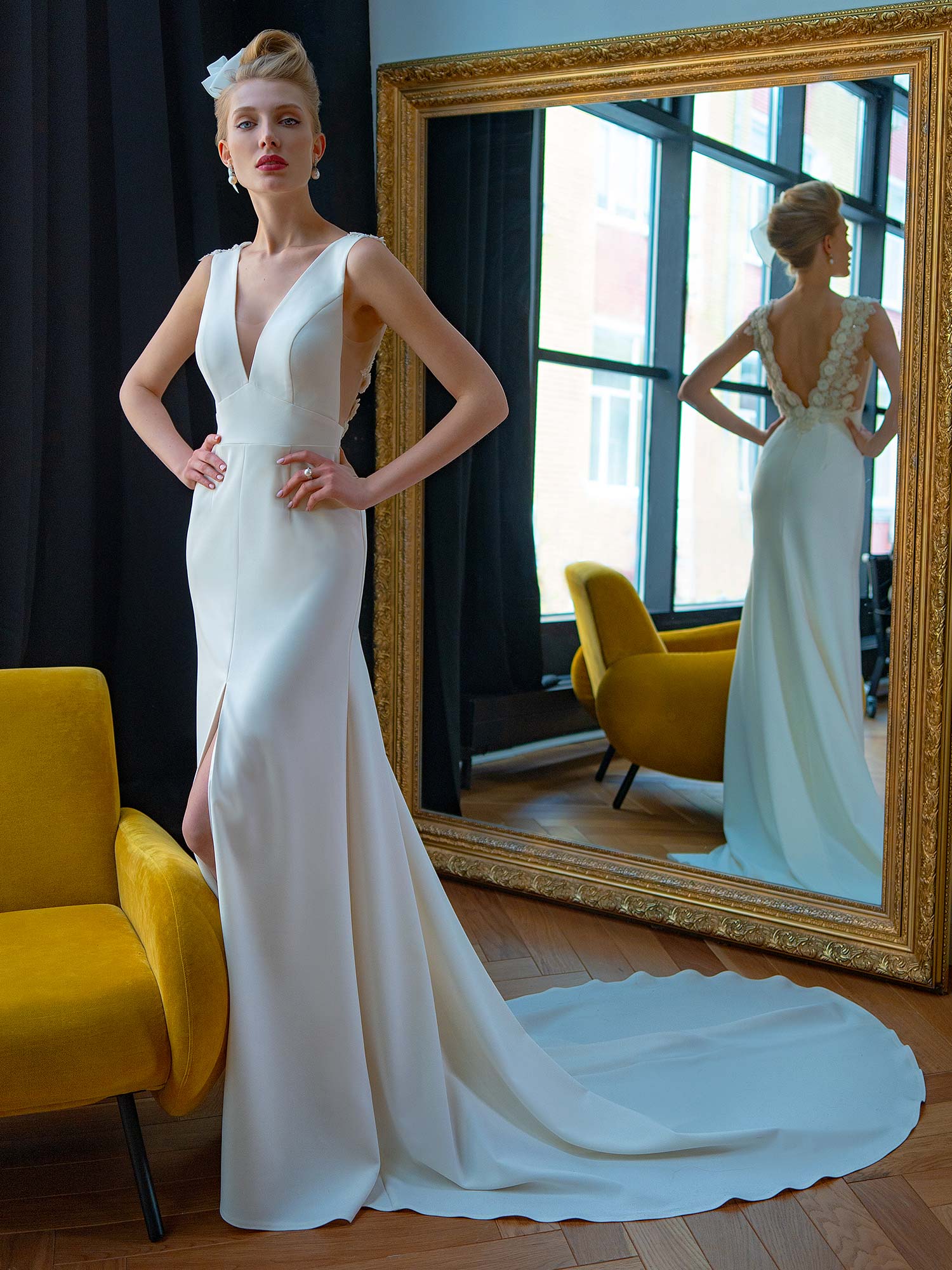 Style #2228L, crepe fit and flare wedding dress with floral embroidered V-back, available in ivory