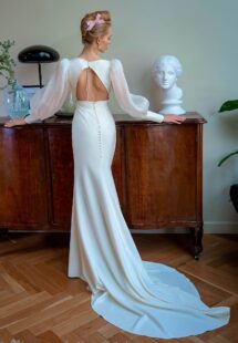 Style #2208L, V-neck fit and flare wedding dress with organza bishop-style sleeves, available in ivory