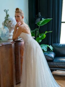 Sequinned lace A-line wedding gown with V-neck and double spaghetti straps