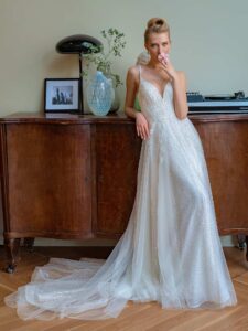 Sequinned lace A-line wedding gown with V-neck and double spaghetti straps
