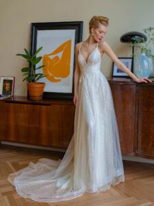 Sequinned lace A-line wedding gown with V-neck and double spaghetti straps