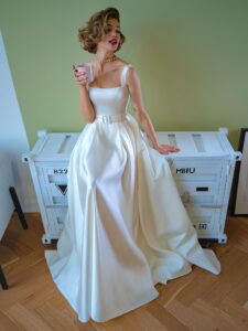 Satin ball gown wedding dress with square neckline and belt