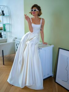 Satin ball gown wedding dress with square neckline and belt