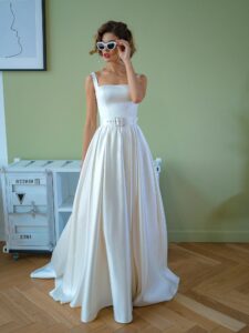 Satin ball gown wedding dress with square neckline and belt