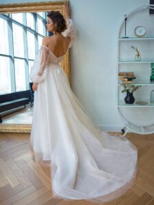 Style #2207L, strapless A-line wedding dress with long puffy sleeves, available in ivory