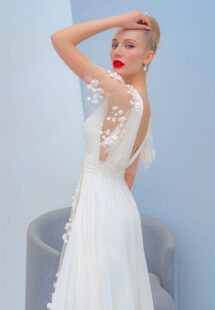 Style #2226L, flutter sleeve chiffon dress with a high slit and 3D floral decor, available in ivory