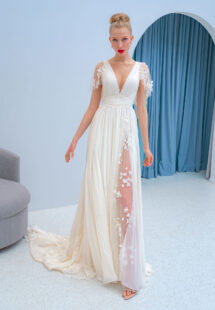 Style #2226L, flutter sleeve chiffon dress with a high slit and 3D floral decor, available in ivory