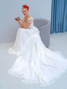 Chiffon sheath wedding dress with embroidered cap sleeves and beaded back