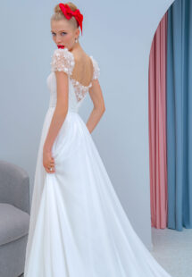 Style #2218L, chiffon sheath wedding dress with embroidered cap sleeves and beaded back, available in ivory