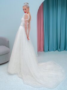 A-line wedding dress with a plunging neckline, long sleeves and puffed shoulders