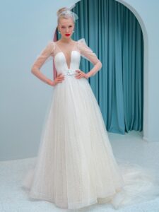 A-line wedding dress with a plunging neckline, long sleeves and puffed shoulders