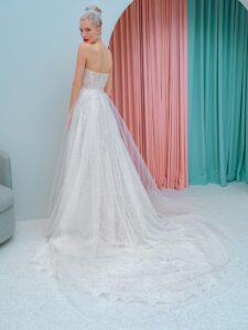 Shimmering lace fit and flare wedding dress with detachable off the shoulder sleeves and tulle train, available in ivory, ivory-nude