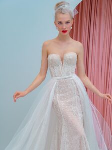 Shimmering lace fit and flare wedding dress with detachable off the shoulder sleeves and tulle train, available in ivory, ivory-nude