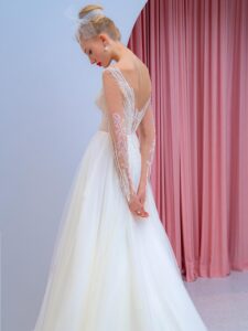 Long-sleeve A-line wedding dress with floral embroidery