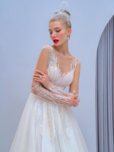 Long-sleeve A-line wedding dress with floral embroidery