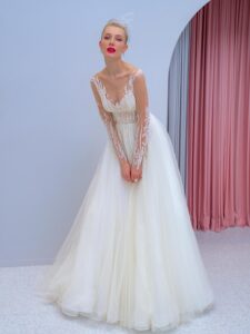 Long-sleeve A-line wedding dress with floral embroidery