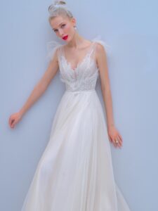 Style #2201L, A-line wedding dress with bow straps and floral embroidered top, available in ivory, dark ivory