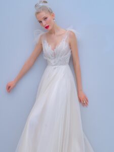 A-line wedding dress with bow straps and floral embroidered top, available in ivory, dark ivory