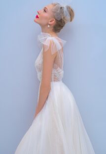 Style #2201L, A-line wedding dress with bow straps and floral embroidered top, available in ivory, dark ivory