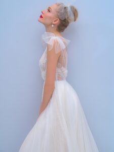 A-line wedding dress with bow straps and floral embroidered top, available in ivory, dark ivory