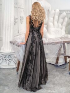 Style #629b, A-line evening dress with floral decor and cascading ruffle trim; available in midi or maxi length; in black