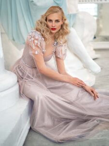 Style #632, shimmering A-line evening gown with long sleeves and puffed shoulders; available in grey-powder