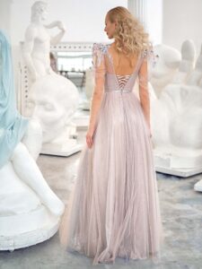 Style #632, shimmering A-line evening gown with long sleeves and puffed shoulders; available in grey-powder