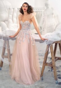Style #647, bustier style A-line gown with floral embroidery and bow straps; available in nude -pink