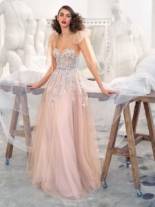 Style #647, bustier style A-line gown with floral embroidery and bow straps; available in nude -pink