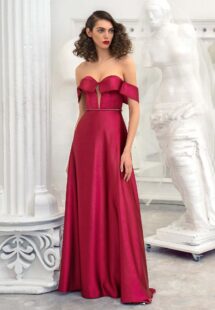 Style #649, satin sheath evening gown with off the shoulder sleeves and beaded belt; available in burgundy, ivory, green, red