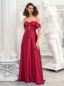 Style #649, satin sheath evening gown with off the shoulder sleeves and beaded belt; available in burgundy, ivory, green, red