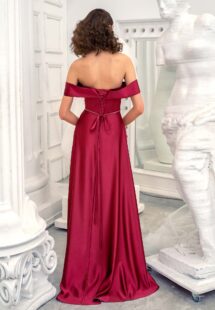 Style #649, satin sheath evening gown with off the shoulder sleeves and beaded belt; available in burgundy, ivory, green, red