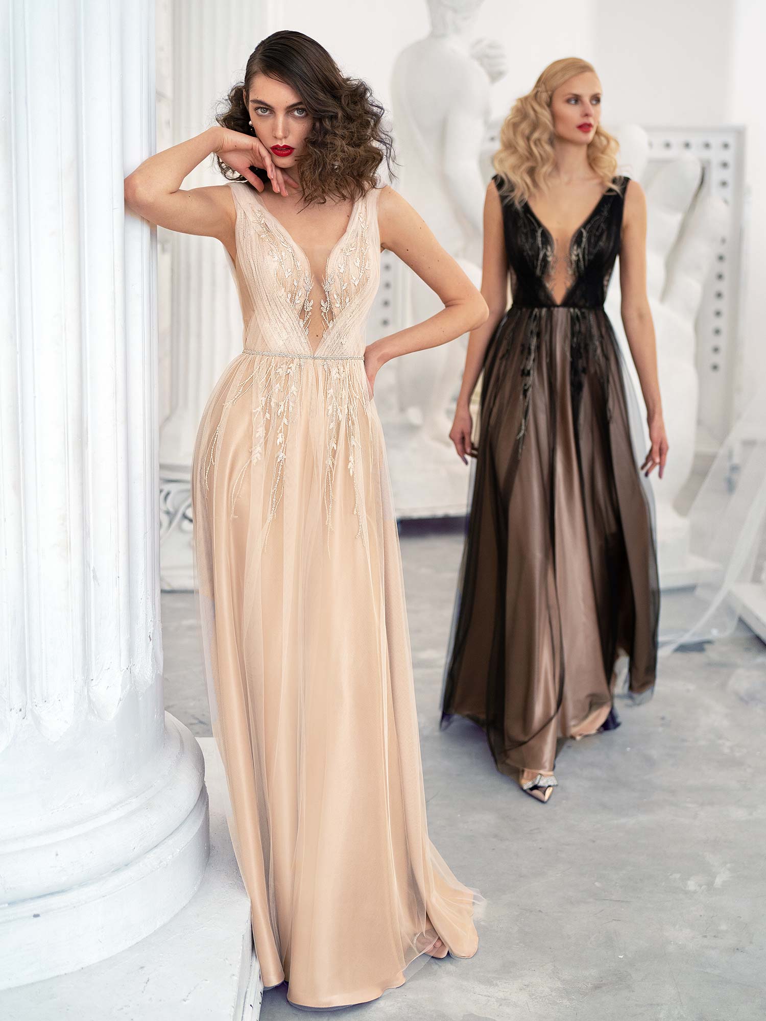 Style #654, A-line evening gown with a plunging neckline, open back and slit down the skirt; available in gold, black