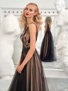 Style #656b, sleeveless A-line formal dress with floral lace top and flowy tulle skirt; available in midi or maxi length; in black-nude, black-powder, ivory, ivory-blue, ivory-powder