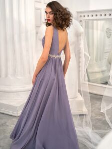 Style #658, chiffon evening dress with a plunging neckline, open back and beaded waistline; available in yellow, ivory, peach, blue, black, smoky, green, azure, cherry, mint, purple, powder