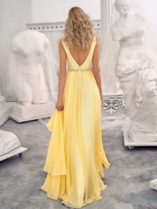 Style #658, chiffon evening dress with a plunging neckline, open back and beaded waistline; available in yellow, ivory, peach, blue, black, smoky, green, azure, cherry, mint, purple, powder